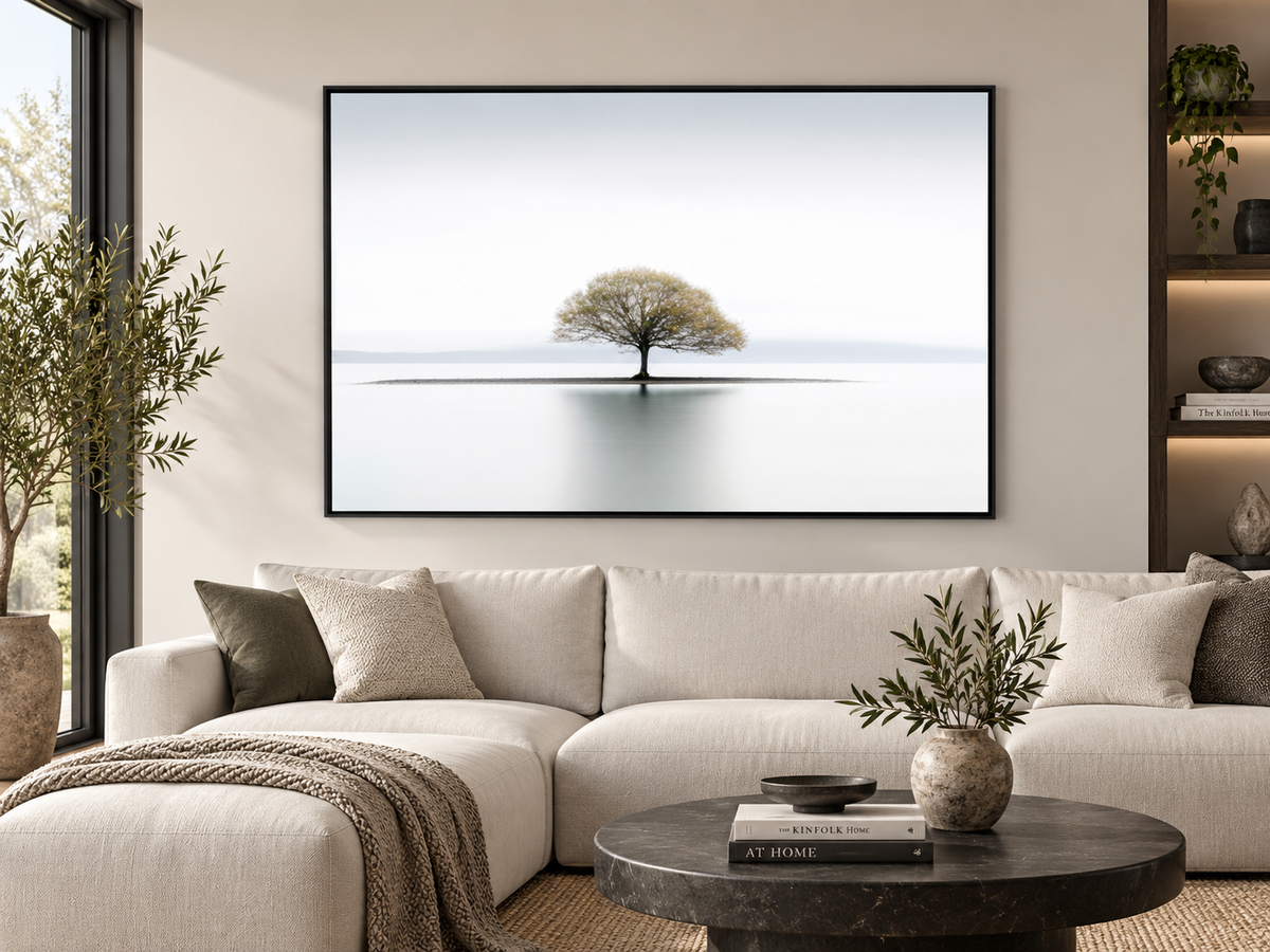 Still | Canvas Print | Minimalist Tree Landscape Wall Art — black-framed canvas above a sofa