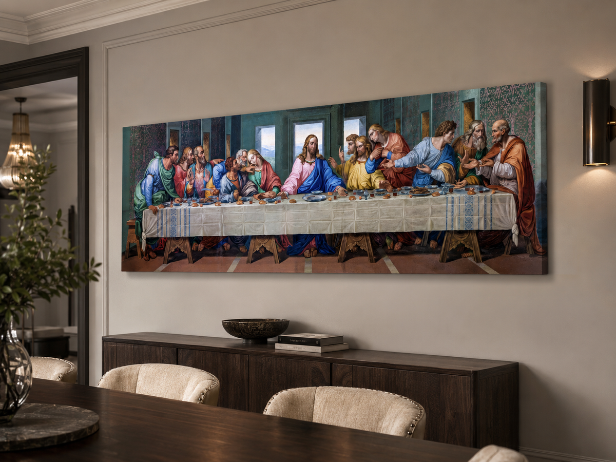 A large panoramic canvas print of Leonardo da Vinci's Last Supper displayed on a beige wall in a modern dining room setting above a dark wood credenza.