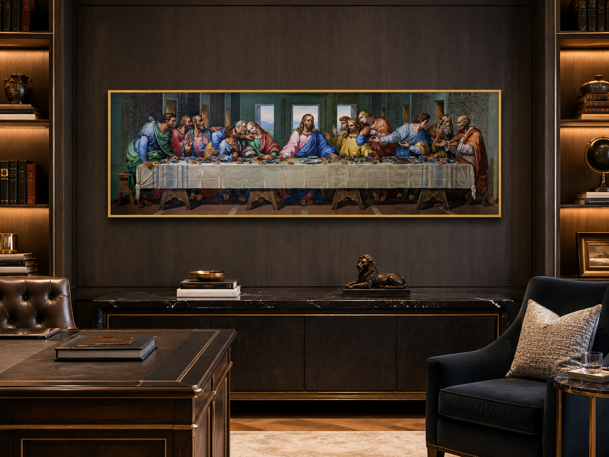 A large framed canvas print of Leonardo da Vinci's Last Supper hangs on a dark wood wall in a luxury office or study setting, flanked by built-in shelves and a dark desk.