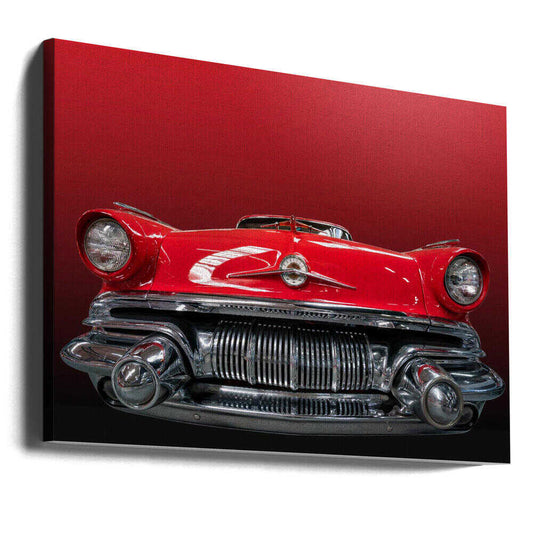 The red Pontiac by Roland Weber, gallery-wrapped canvas viewed at an angle; the front of a red Pontiac with a chrome grille and headlights against a red background.