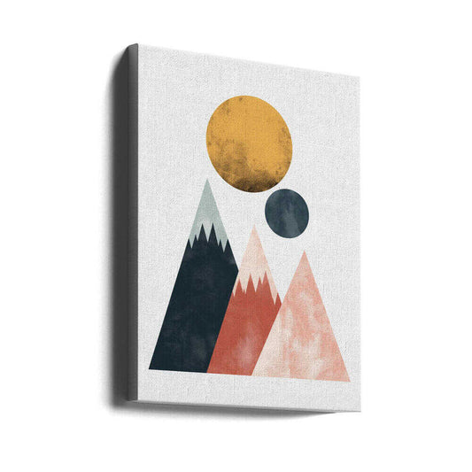 Two Moons by SHANDU, gallery-wrapped canvas viewed at an angle; three geometric mountain peaks beneath a gold-toned disc and a smaller dark moon.